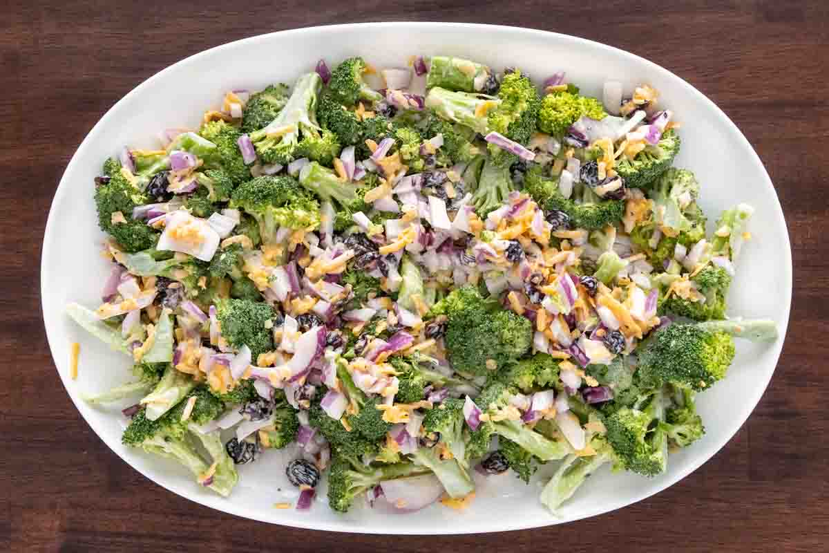 Broccoli salad on a white platter.