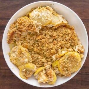 Squash casserole in a white bowl.