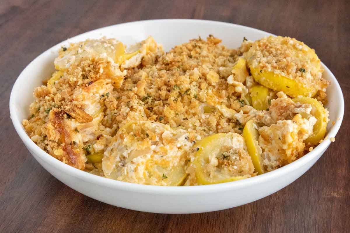 Squash casserole in a white bowl.