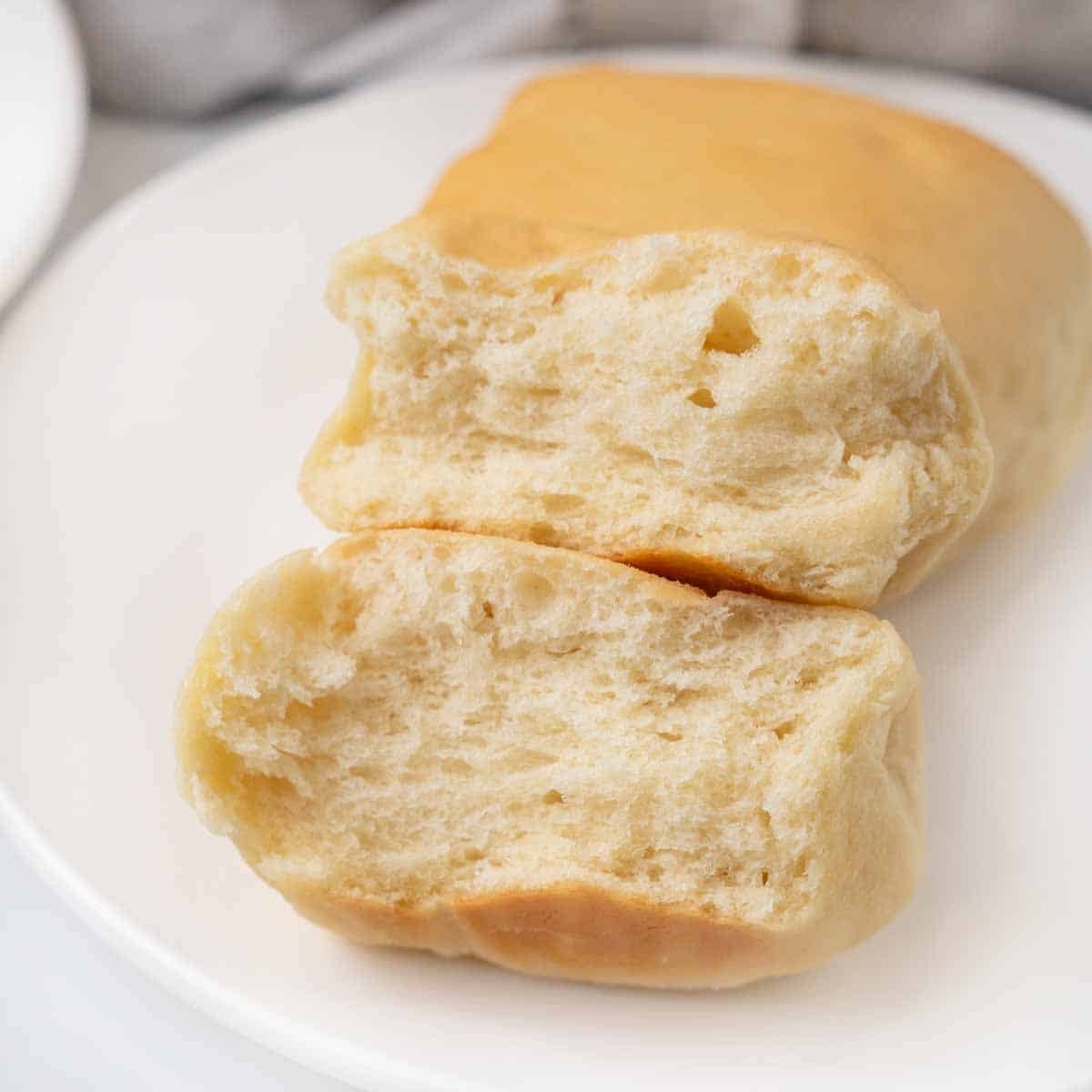 Texas roadhouse rolls on a white plate.