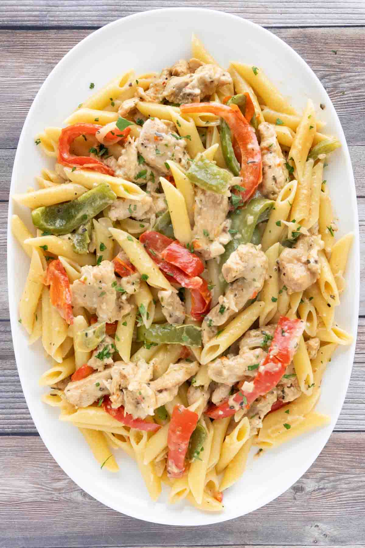 Chicken Fajita pasta in a white platter.