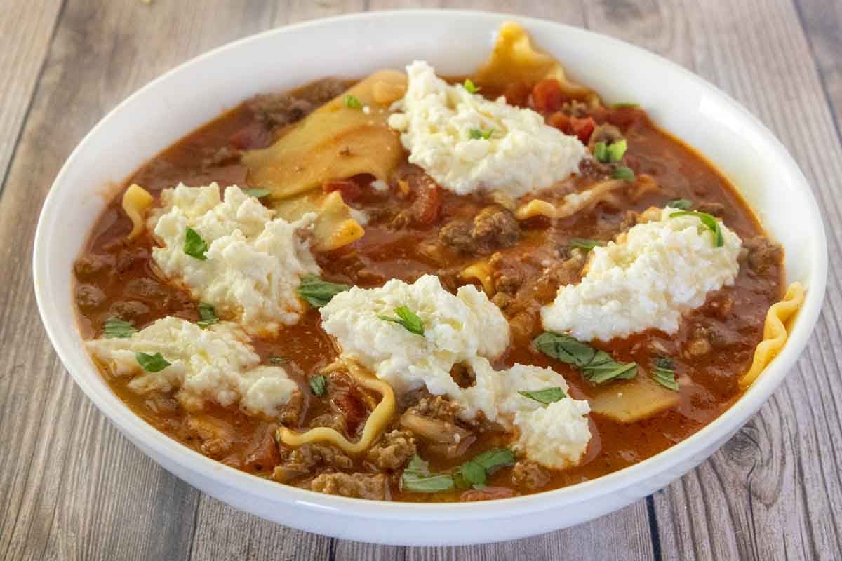 Lasagna soup in a white bowl.