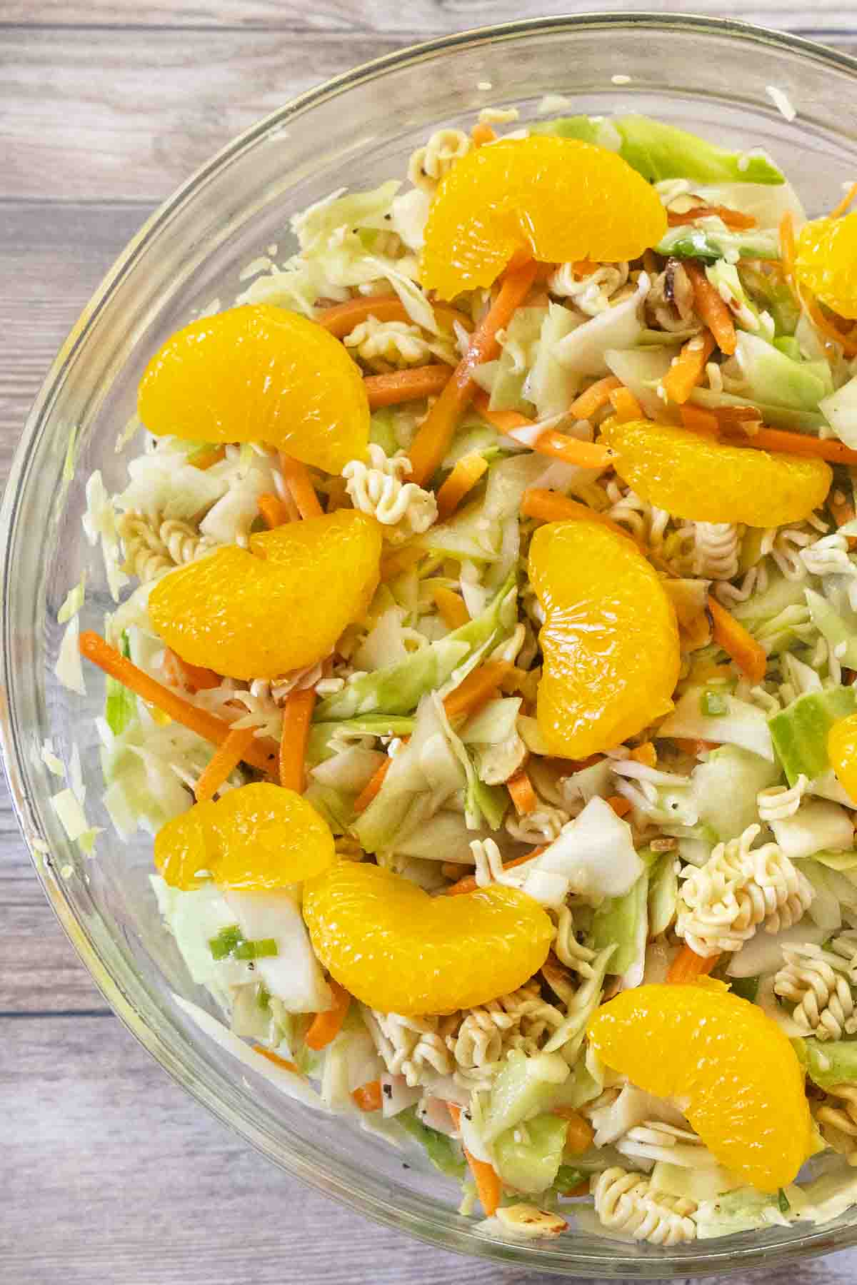 Ramen salad in a glass bowl.