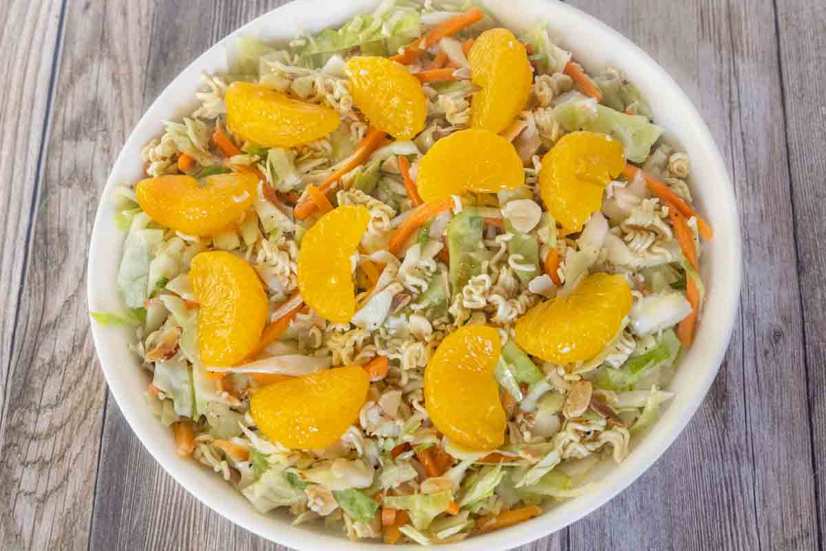 Ramen salad in a white bowl.
