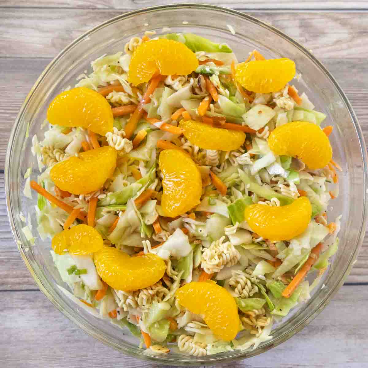 Ramen salad in a glass bowl.