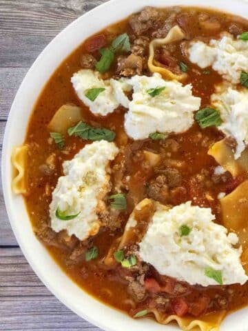 Lasagna soup in a white bowl.