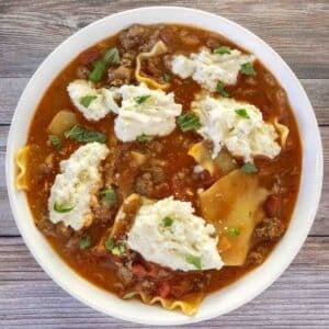 Lasagna soup in a white bowl.