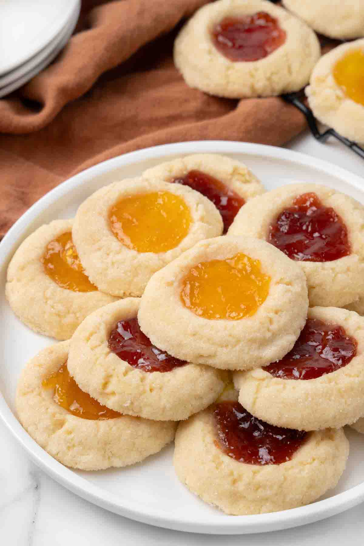 Thumbprint cookies on a white platter.