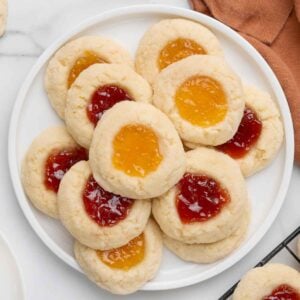 Thumbprint cookies on a white platter.