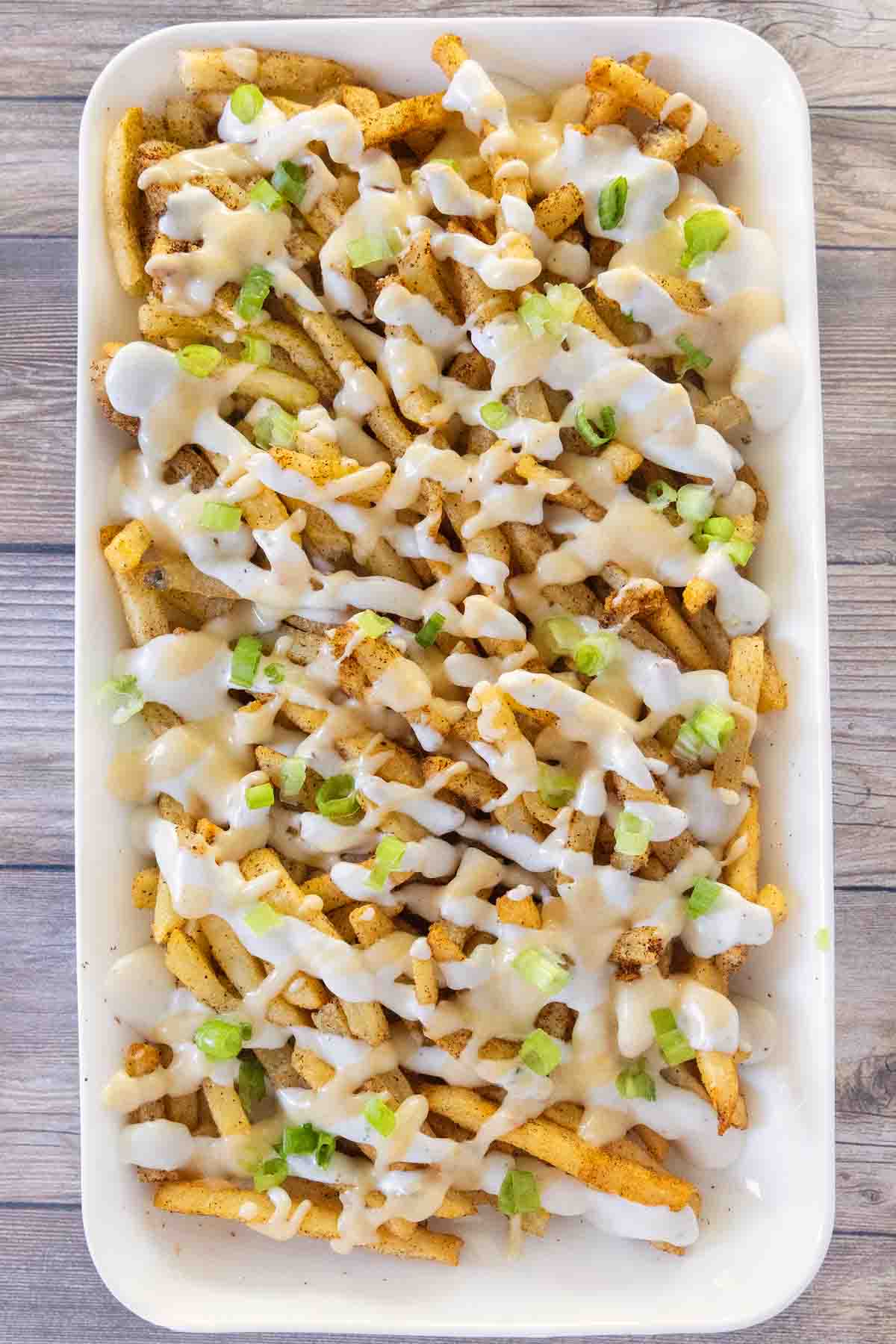 Louisiana voodoo fries on a white platter.