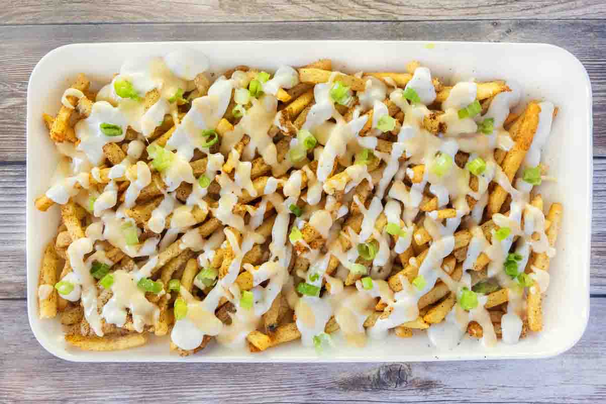 Louisiana voodoo fries on a white platter.