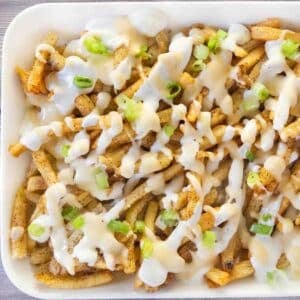 Louisiana voodoo fries on a white platter.