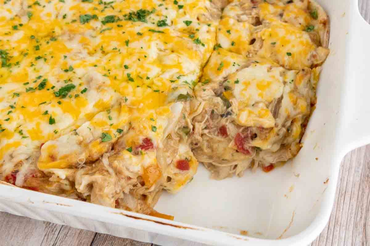KIng ranch casserole in the casserole pan with a piece taken out.